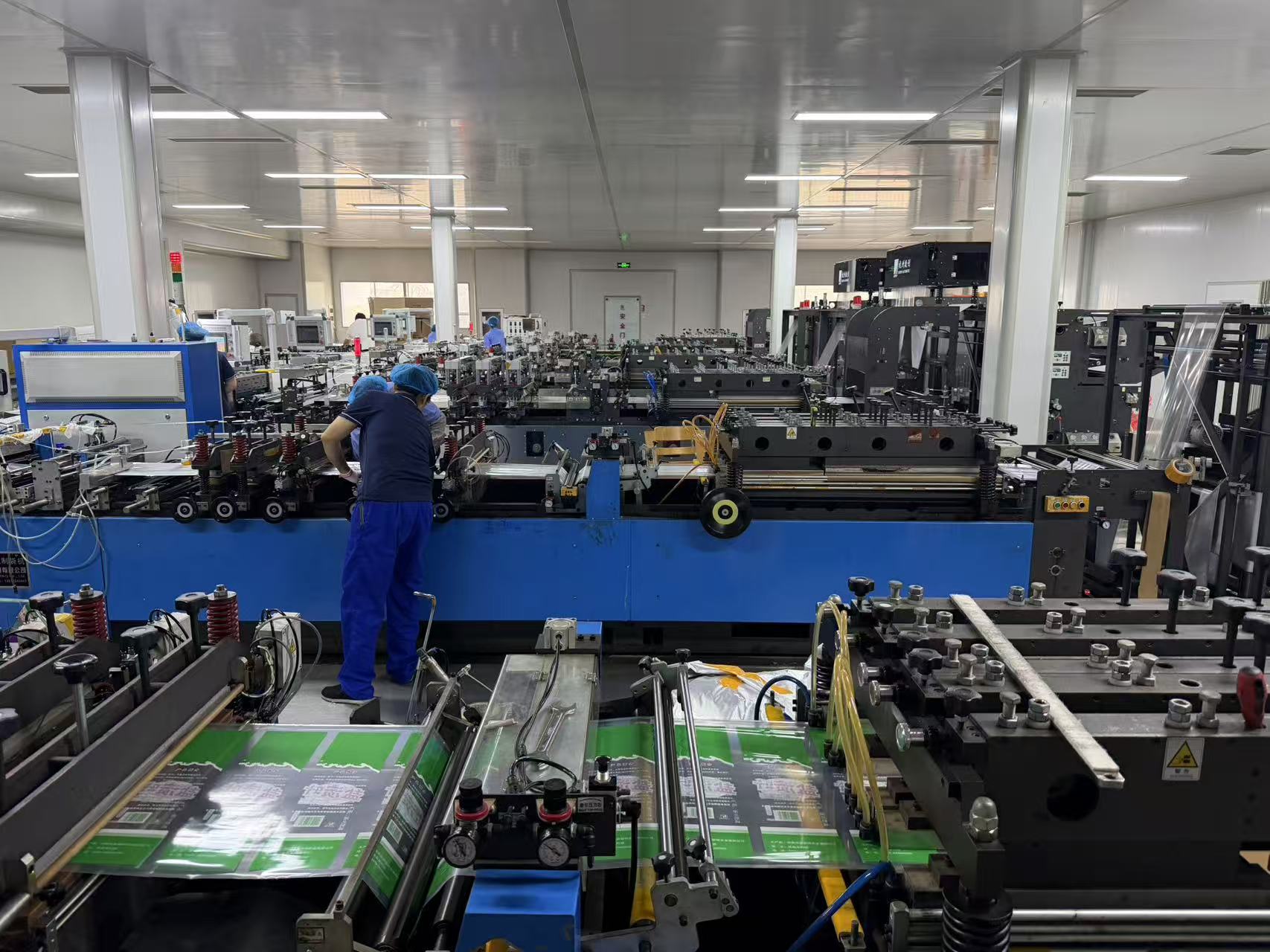 Operators at the bag-making line at Miaoman Packaging